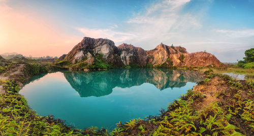 Scenic view of lake against sky during sunset