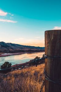 Scenic view of lake against sky during sunset