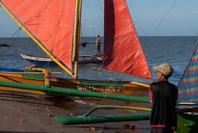 Rear view of woman on boat sailing in sea