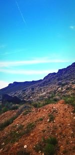 Scenic view of land against clear blue sky