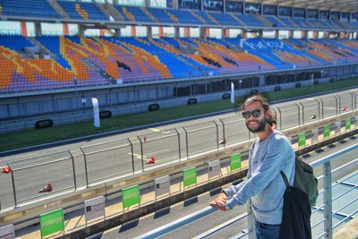 Full length of man standing in racing track