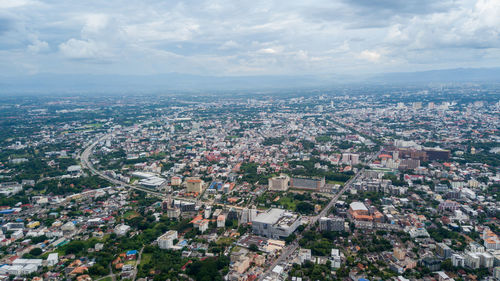 Aerial view of cityscape against sky