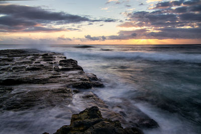 Scenic view of sea against sky during sunset