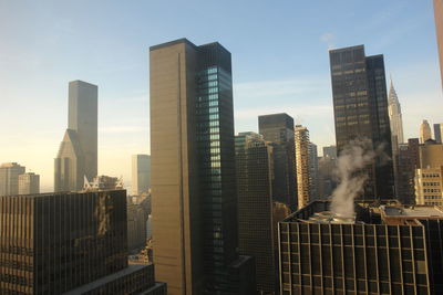 Modern buildings in city against sky