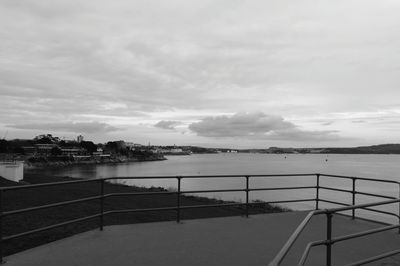 Staircase by sea against sky