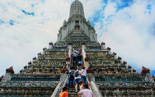 People climbing steps of temple of dawn