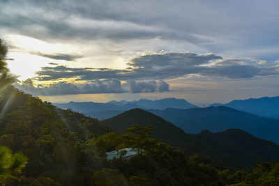 Scenic view of mountains against sky at sunset