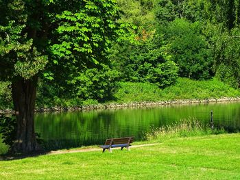 People in park bench by lake