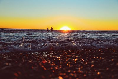 Scenic view of sea at sunset