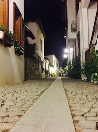 Houses against sky at night