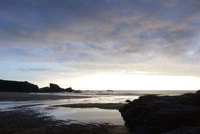 Scenic view of sea against sky at sunset