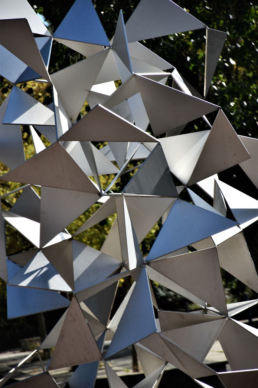 LOW ANGLE VIEW OF UMBRELLAS ON UMBRELLA