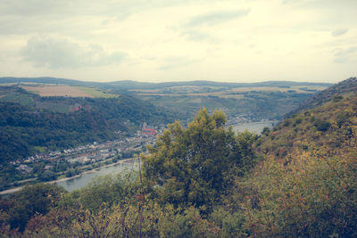 High angle view of river with mountains in background