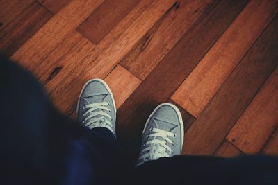 Low section of woman standing on floor