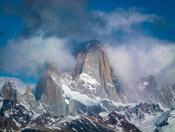 Scenic view of snowcapped mountains against sky