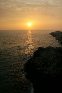 Scenic view of sea at sunset