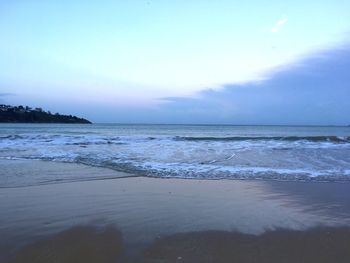 Scenic view of beach and sea against sky