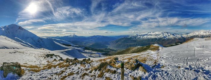 Scenic view of mountains against sky during winter