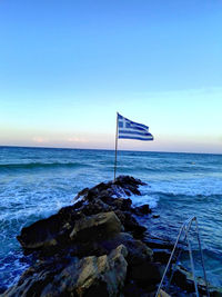 Scenic view of beach against blue sky