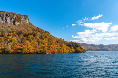 Autumn foliage scenery of lake towada. aomori, japan.