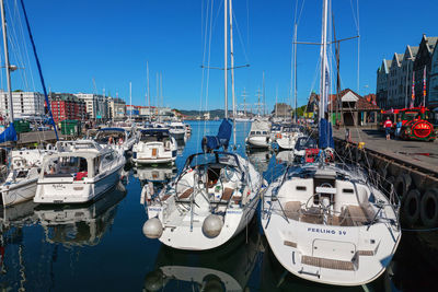 Boats moored at harbor