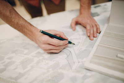 High angle view of man working on table