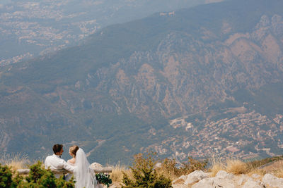 Rear view of couple on mountain