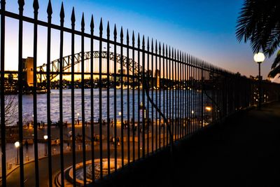 Bridge over river in city at night