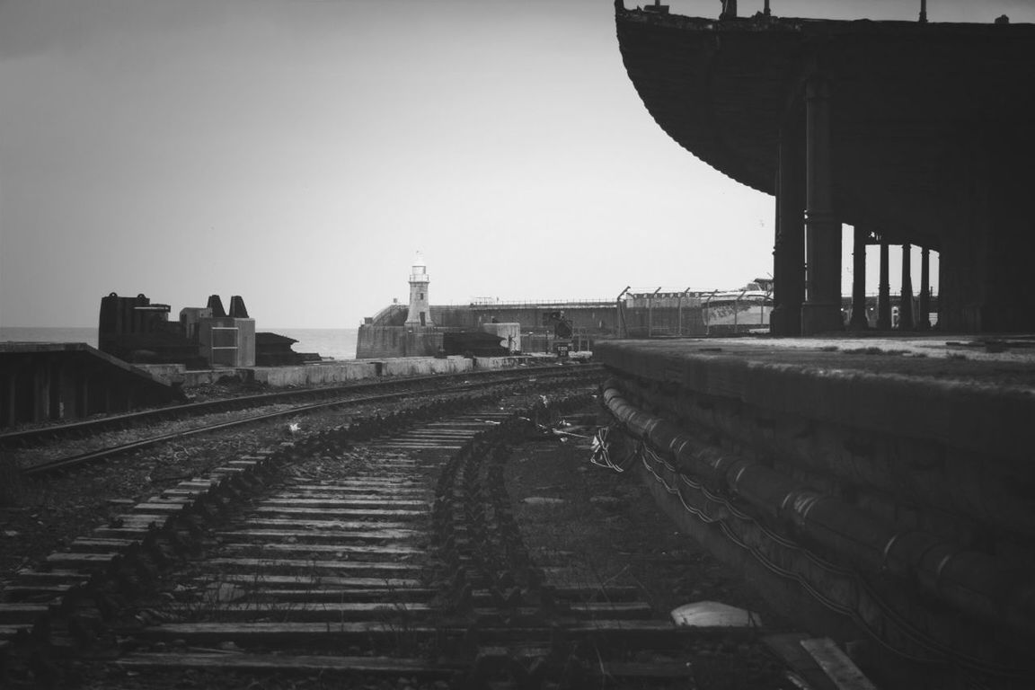 railroad track, built structure, architecture, transportation, the way forward, rail transportation, clear sky, diminishing perspective, vanishing point, public transportation, building exterior, railroad station, copy space, railroad station platform, travel, sky, long, no people, day, connection