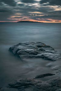 Scenic view of sea against sky at sunset