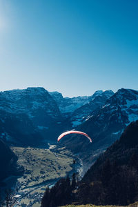 Scenic view of mountains against clear blue sky