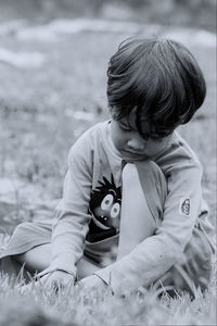 Cute boy playing on field