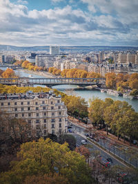 Aerial view of paris city, france. scenery fall season cityscape with yellow trees along seine river