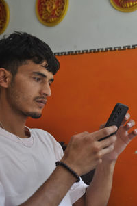 Young man using mobile phone