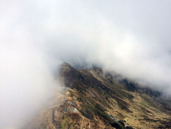 Scenic view of mountain during foggy weather