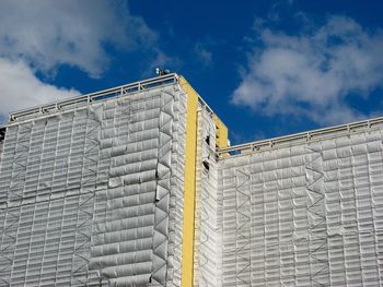 Low angle view of building against blue sky