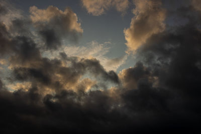 Low angle view of cloudy sky during sunset
