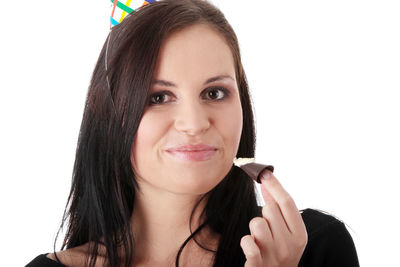 Portrait of a smiling young woman over white background