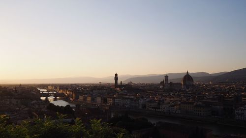 Cityscape against sky during sunset