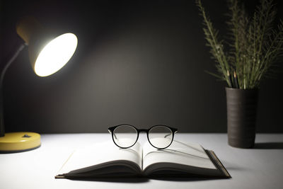 Close-up of electric lamp on table