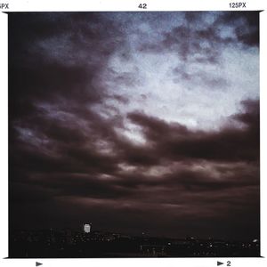 Cityscape against cloudy sky