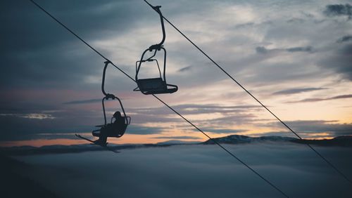 Silhouette of person in a chairlift