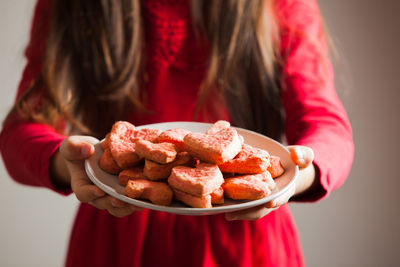 Midsection of woman holding ice cream