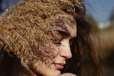 Close-up of young woman with eyes closed