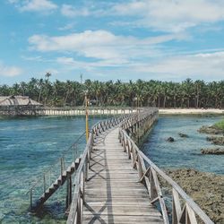 Pier over sea against sky