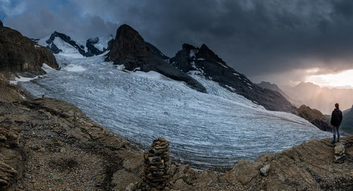 Panoramic view of snowcapped mountains against sky