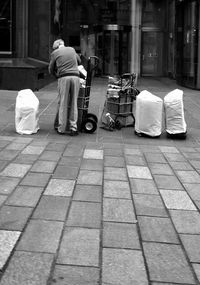 Rear view of woman walking on street