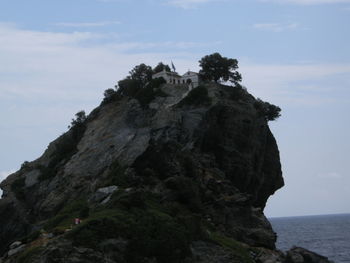 Low angle view of rock formation against sky