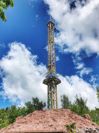 Low angle view of tower against cloudy sky