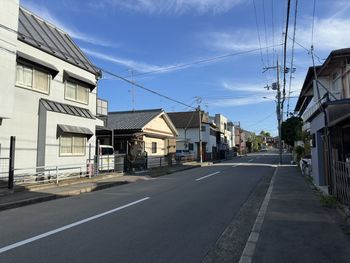 Street amidst buildings against sky